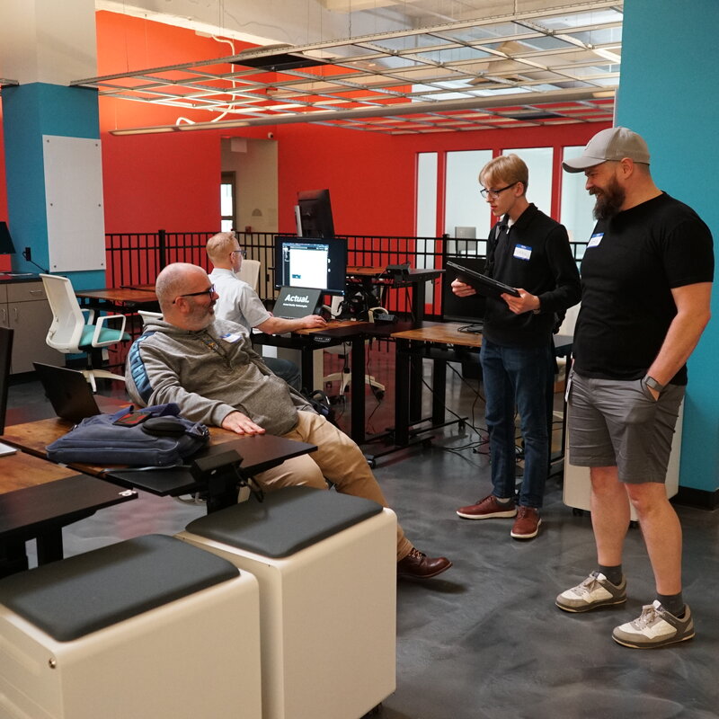 Members collaborating in the open workspace